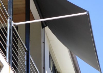 Image of installed Pivot Arm Blinds on a Balcony